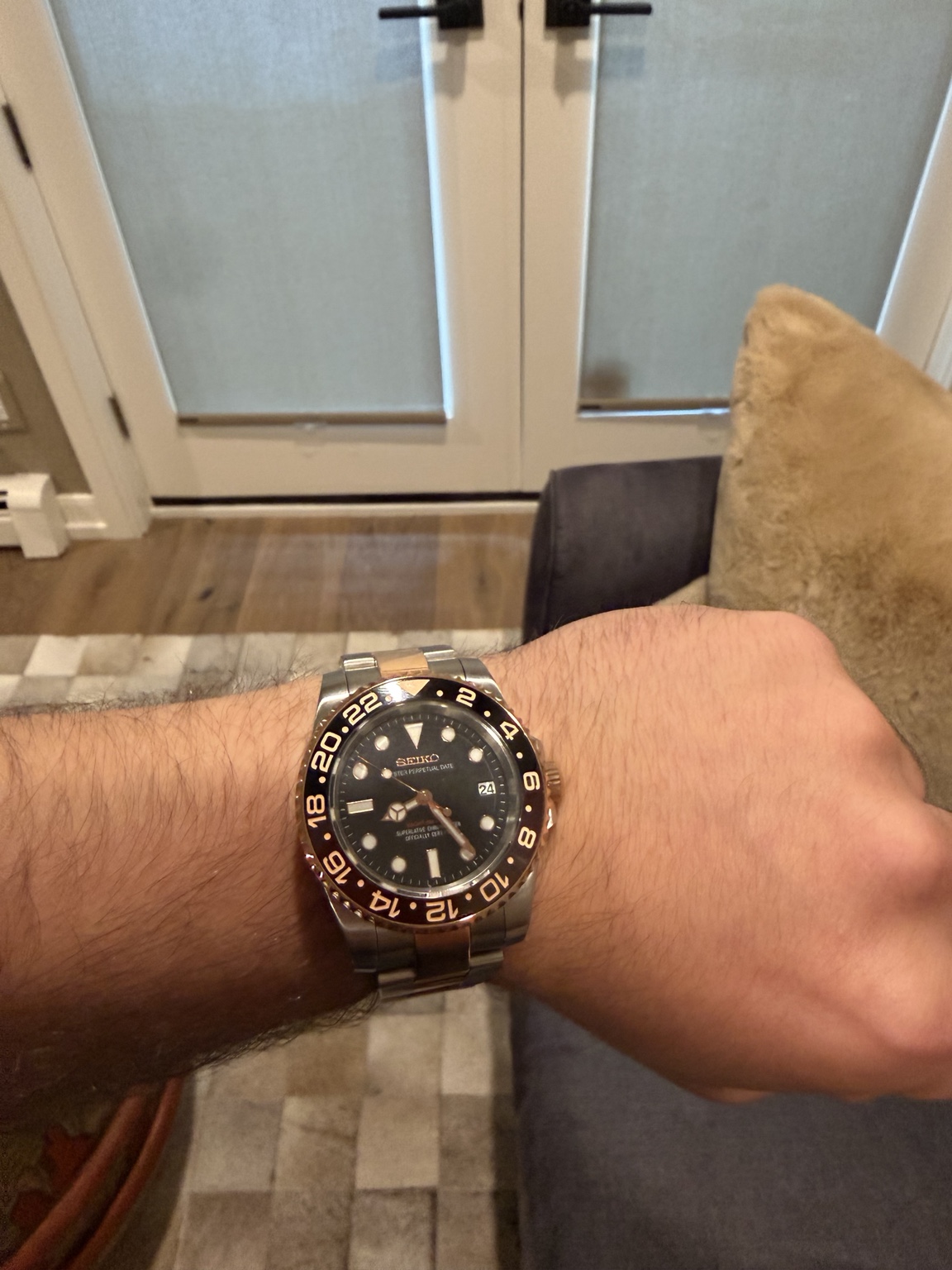 Matthew wearing the Root Beer NH35 Seiko mod on its two-tone bracelet